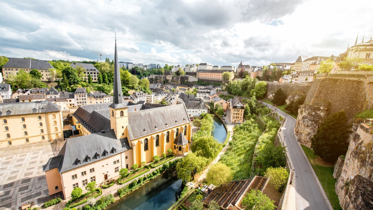 Top view on the Grund district with Saint Johns church and Neumunster abbey in Luxembourg city