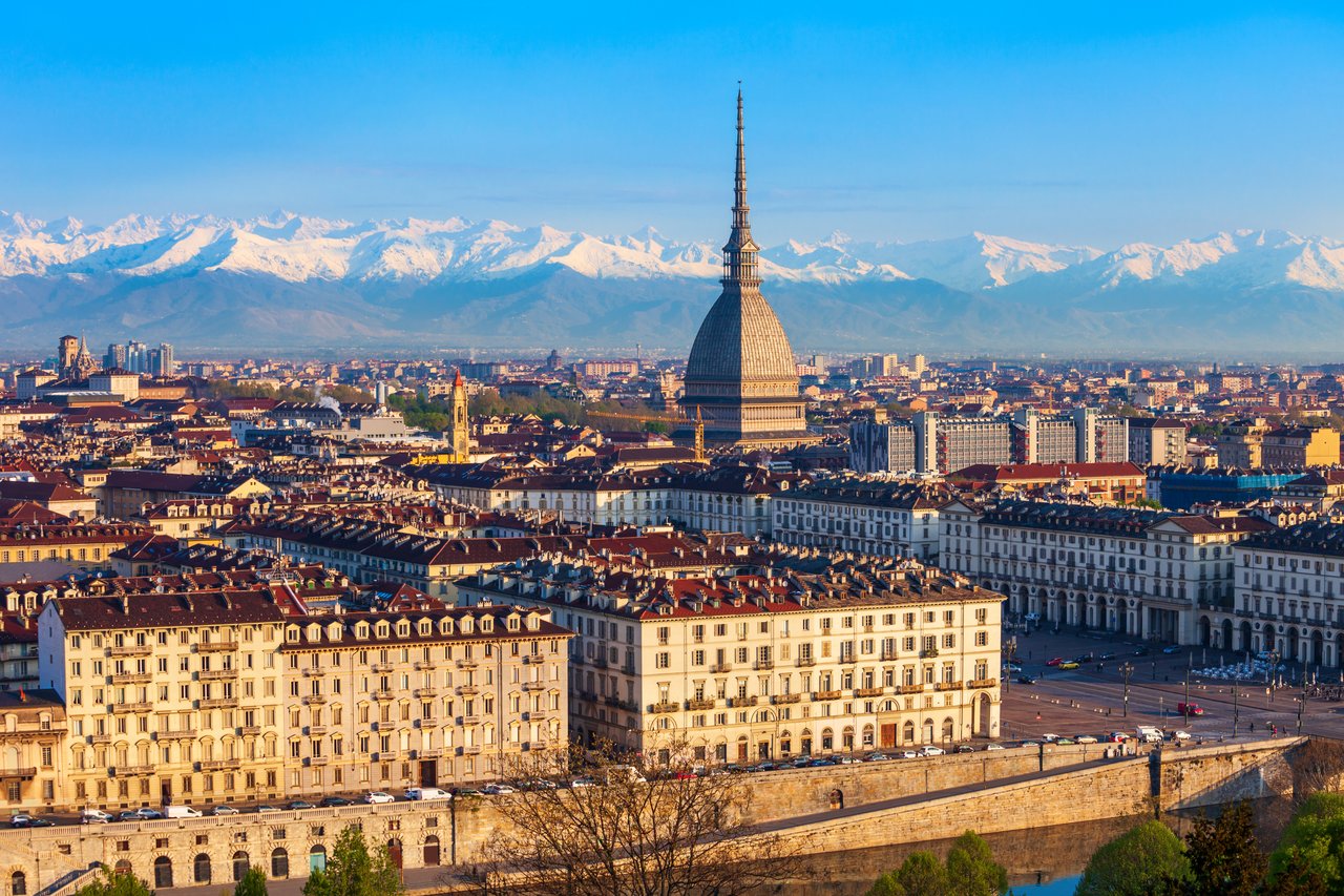 Photo of Turin with the Mole Antonelliana tower in the center.